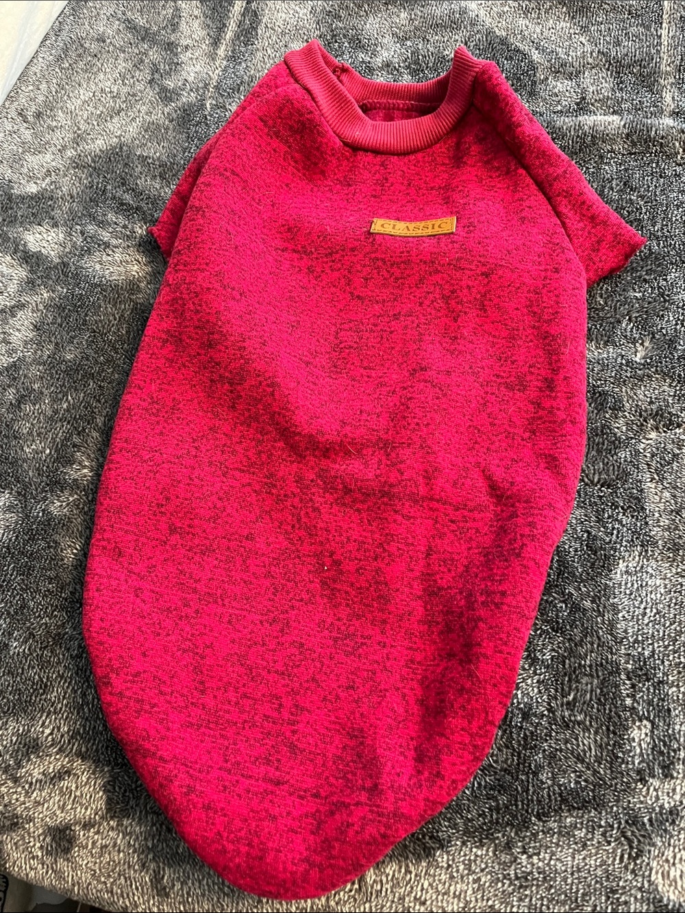 Dog sweater tag says 2XL but I believe it is more like a medium reddish pink